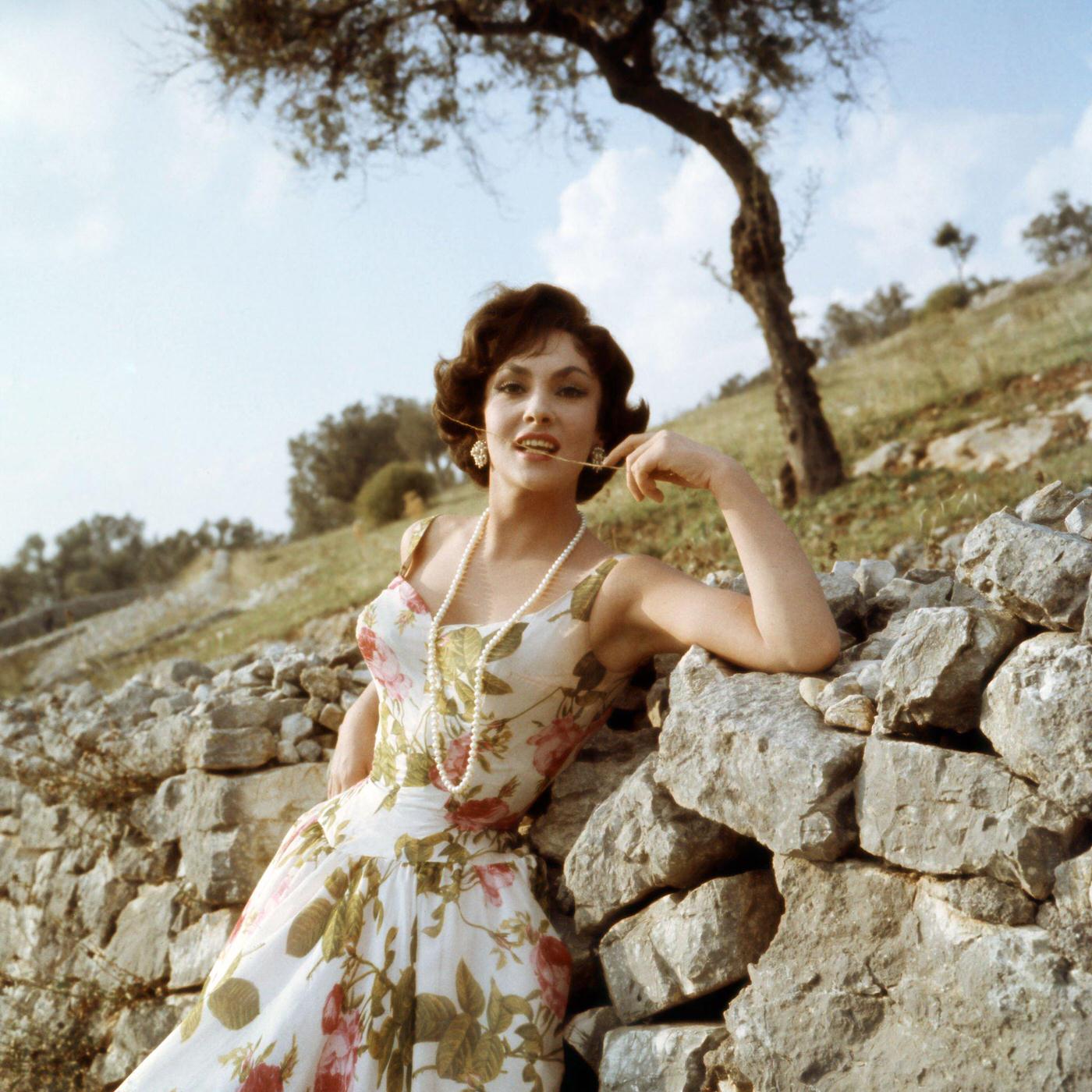 #89 Actress Gina Lollobrigida poses for a portrait in Portofino, Italy, 1960.