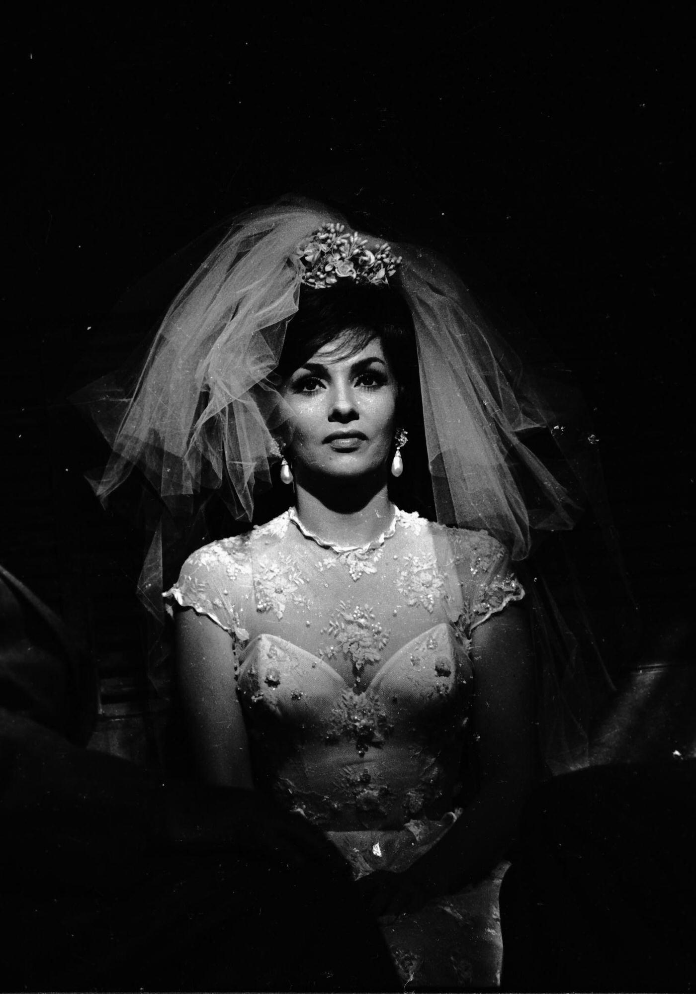 #94 Gina Lollobrigida dressing as a bride for “Come September” in Roma, Italy, 1960.