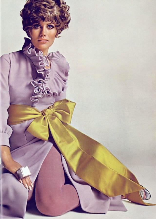 #6 Maud Adams in Lavender Evening Shirt and Chartreuse Satin Sash by Andrew Woods, Harper’s Bazaar, December 1967