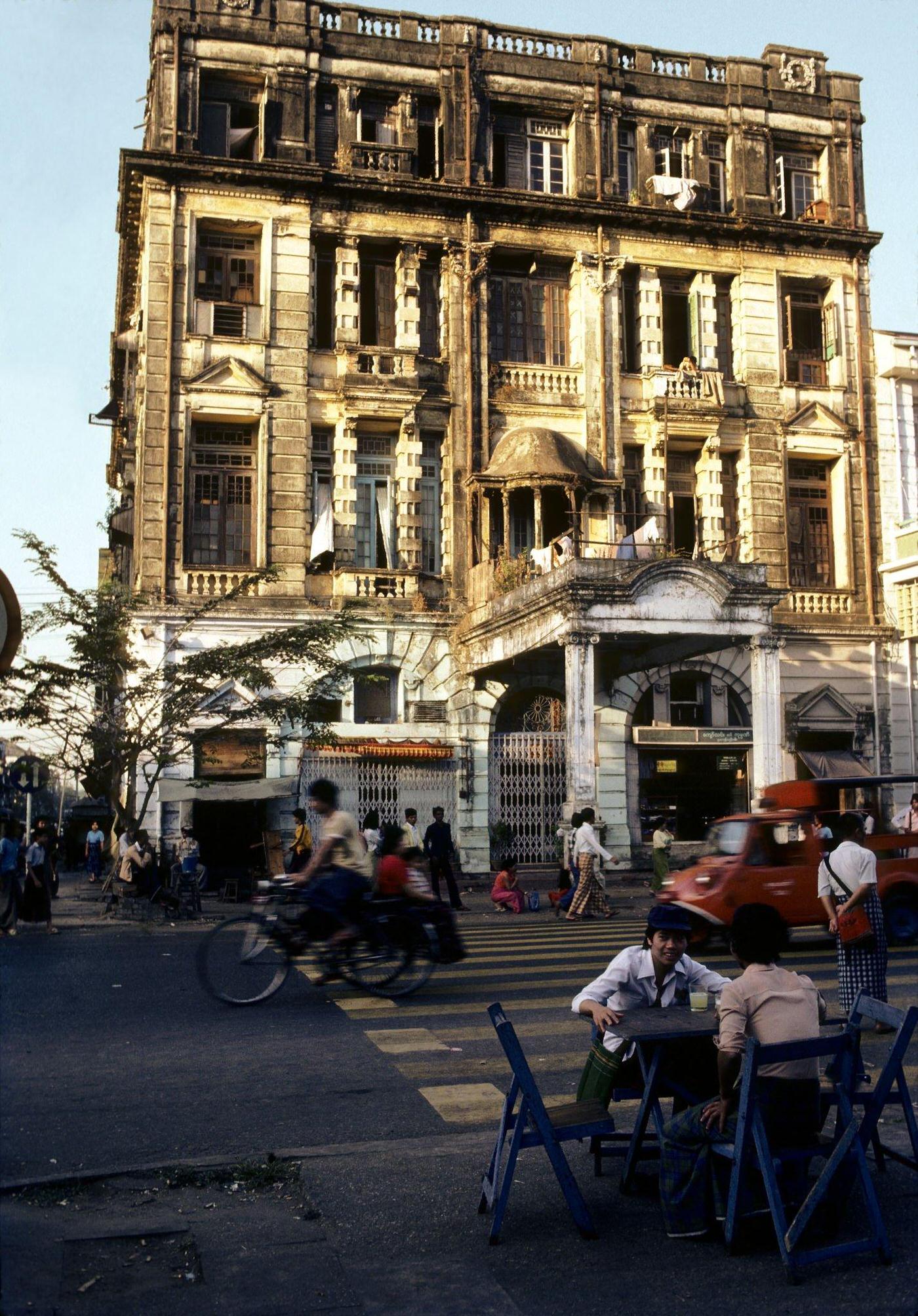 #2 Couple Enjoying Fresh Lemonade at a Kerbside Restaurant, Sun Sets on a Busy Street in Rangoon, Burma, 1985