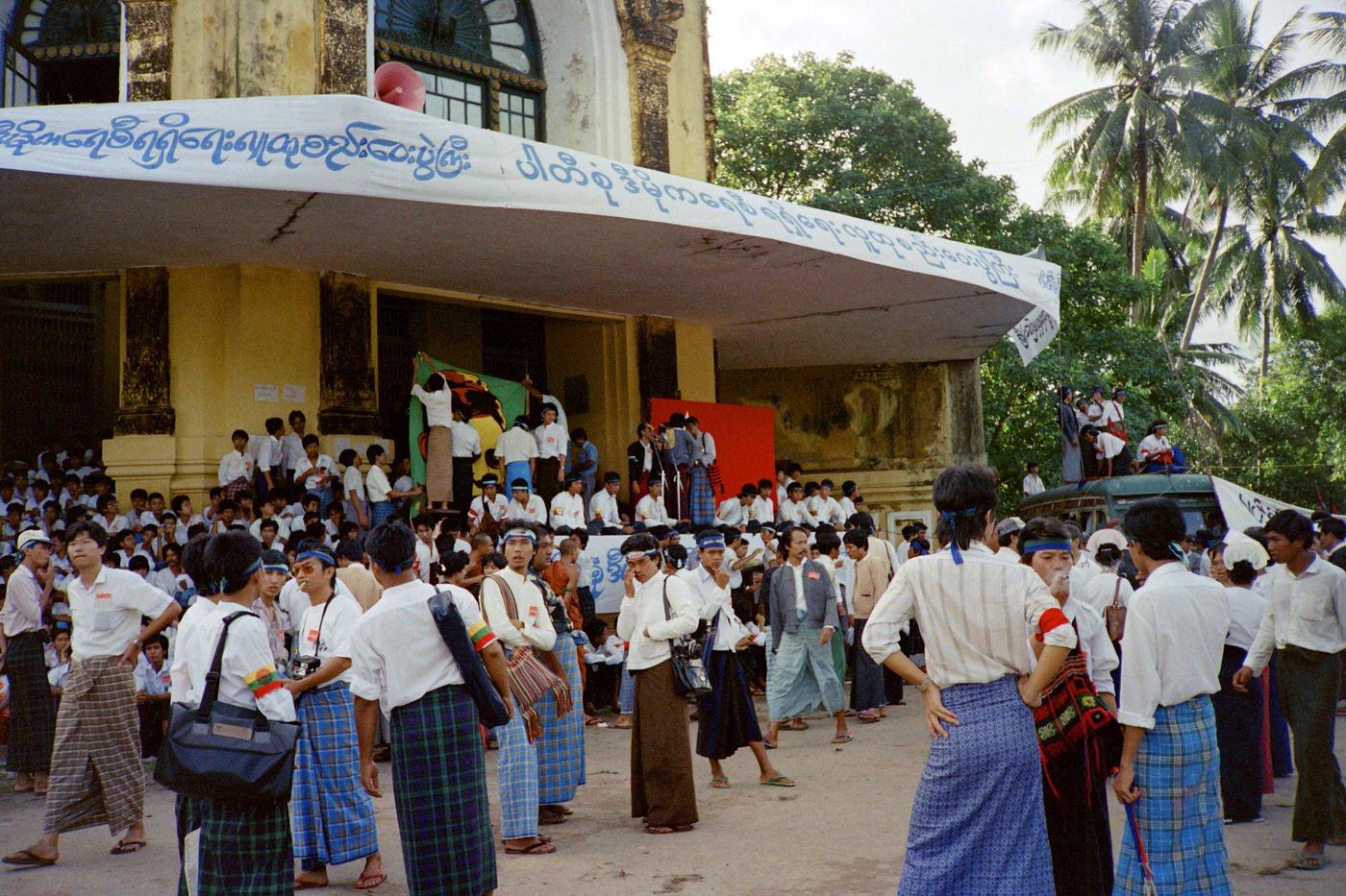 #19 Anti-government protestors march in Rangoon demanding multi-party rule during the 8888 Uprising, 1988.