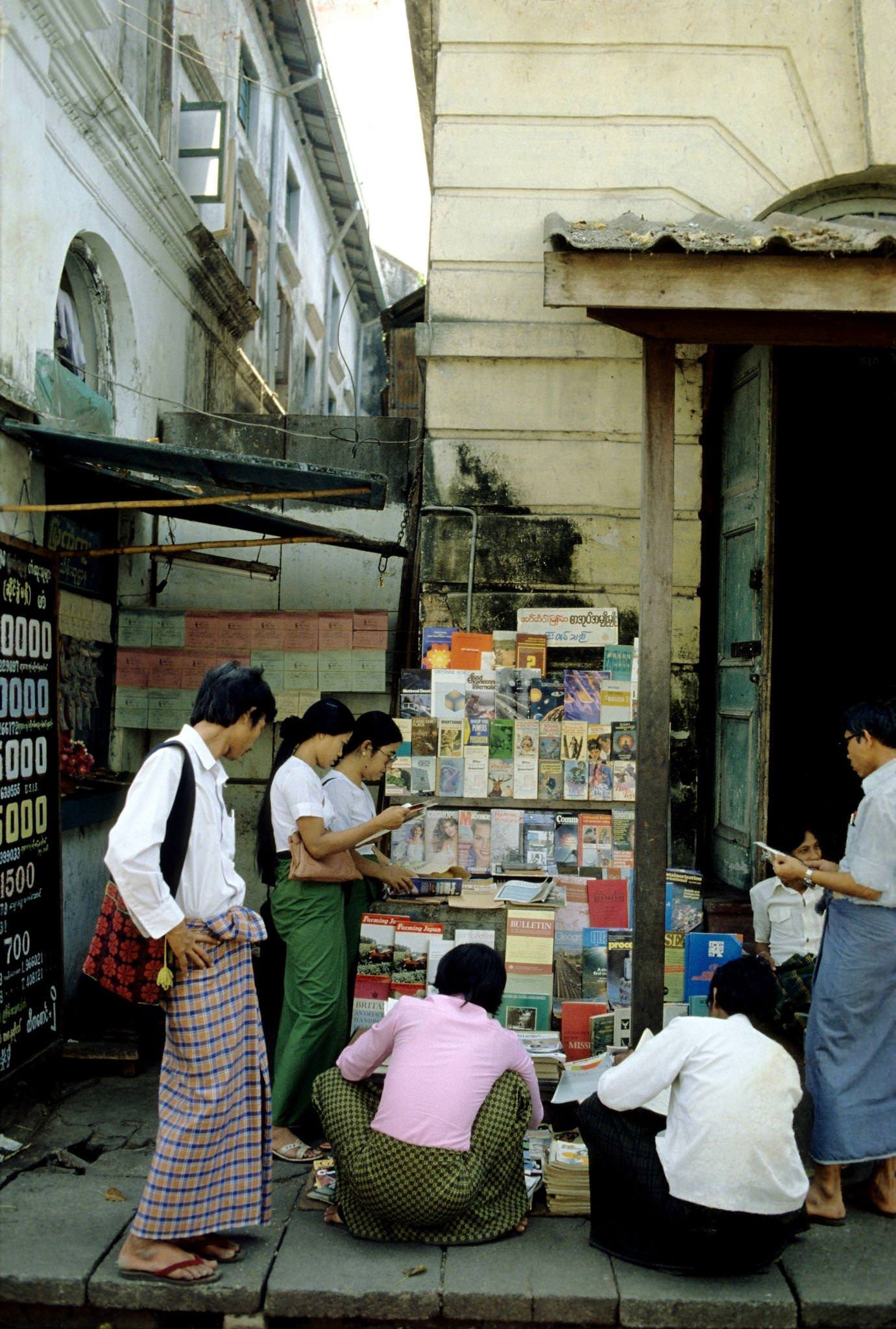 #31 Street Vendor Offers Pre-Owned Magazines and Books at a Kerb-Side Stall in Rangoon, Burma, 1985