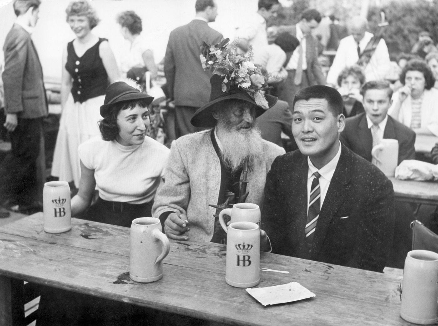 #11 Japanese tourists enjoying Oktoberfest with Bavarians, 1960.