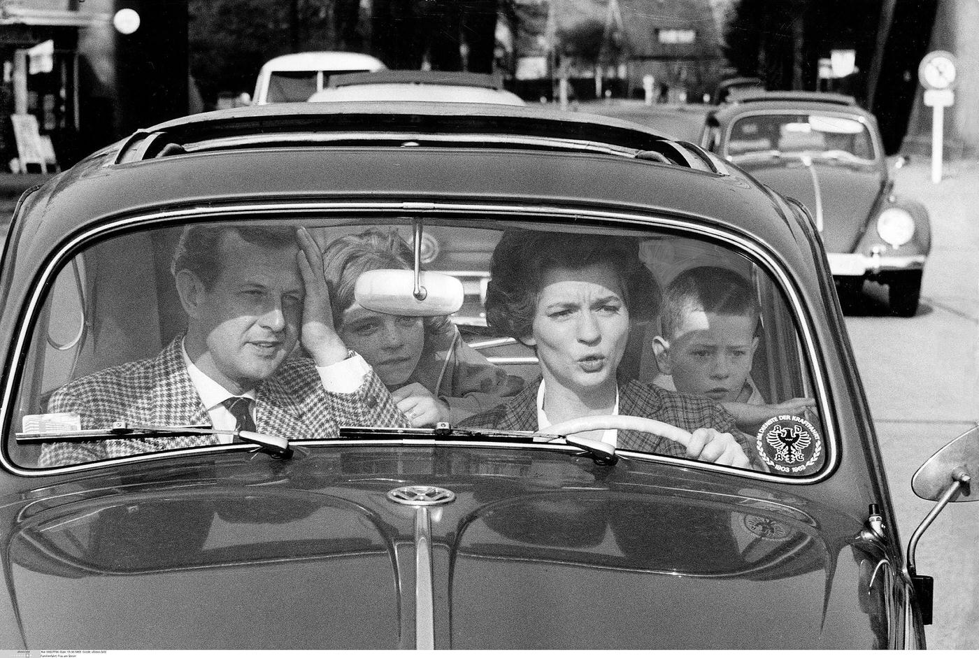 #21 Family driving, critical moment captured. 1963.