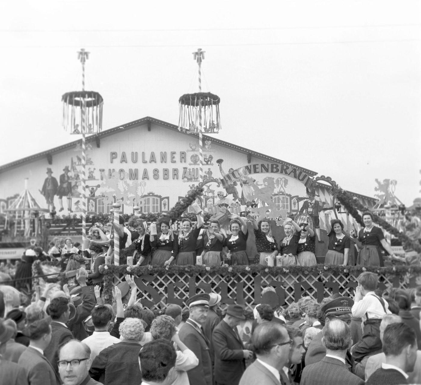 #26 Wiesn waitresses arrive at Paulaner marquee, 1963.