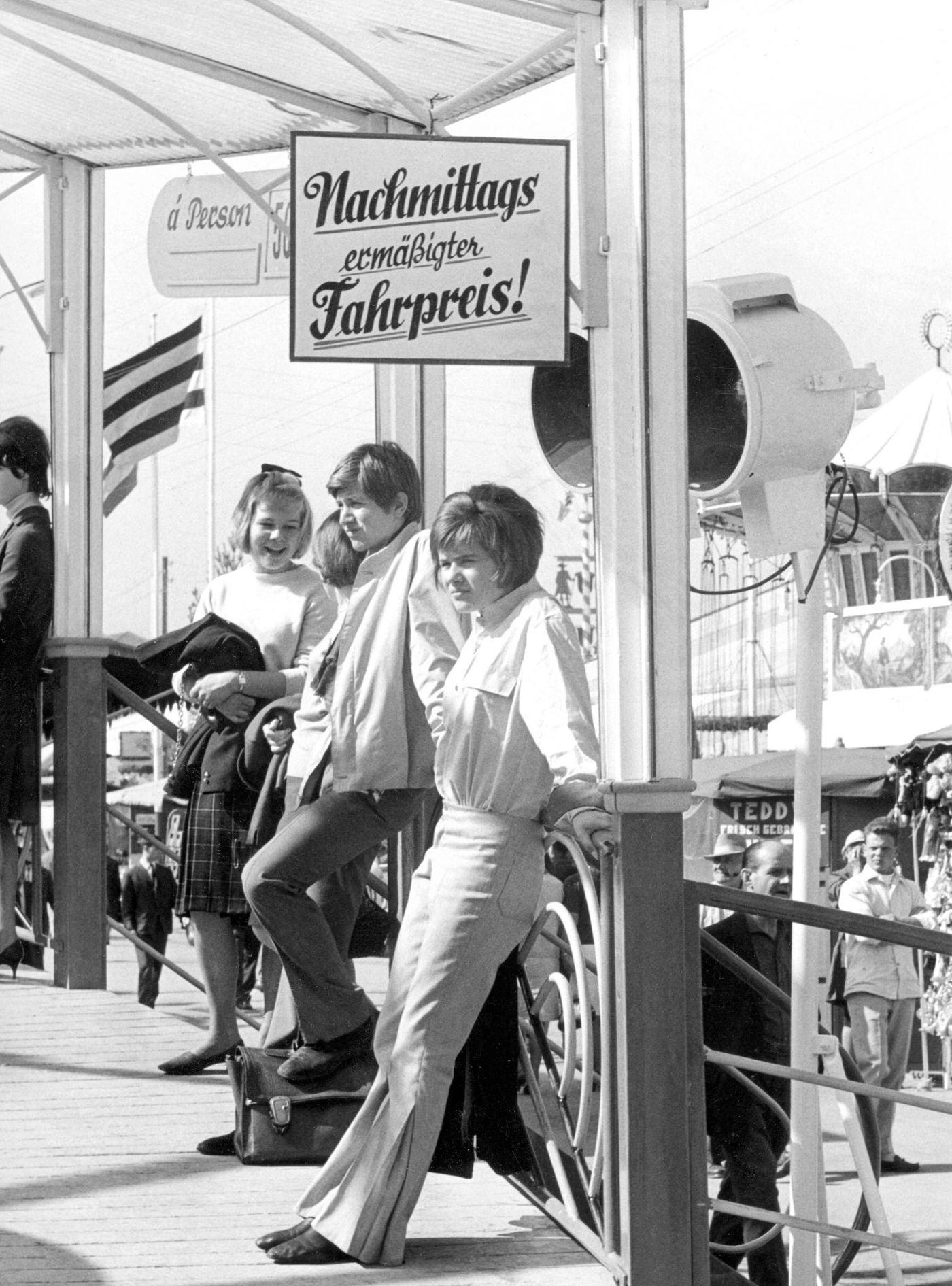 #35 Youth at Oktoberfest in Munich, enjoying a ride. 1965.