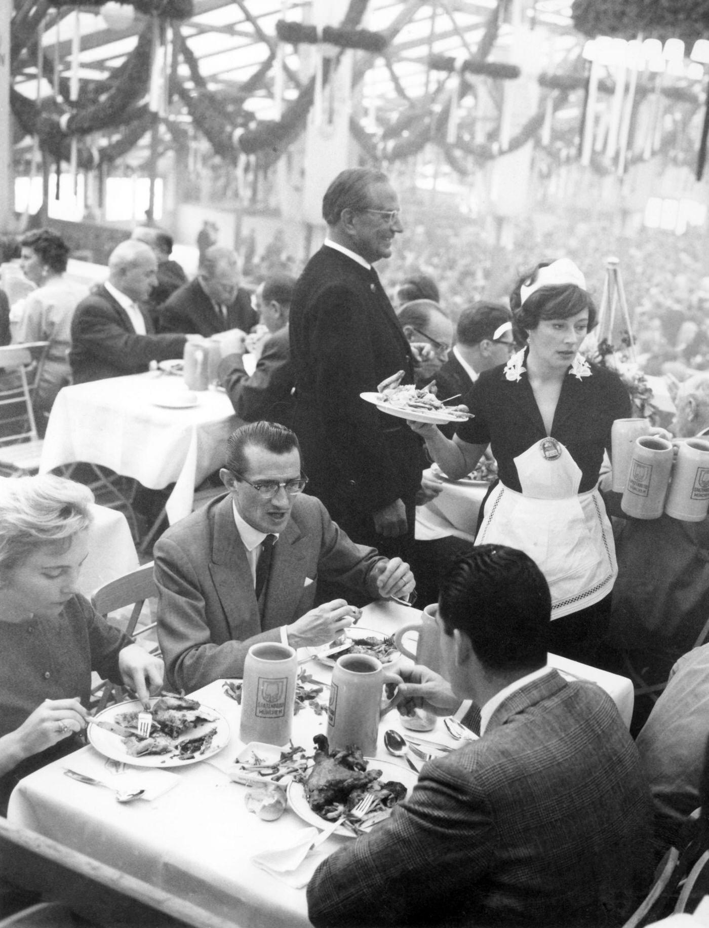 #6 Elfie Pertramer as Wiesn waitress at Oktoberfest Munich, 1960.