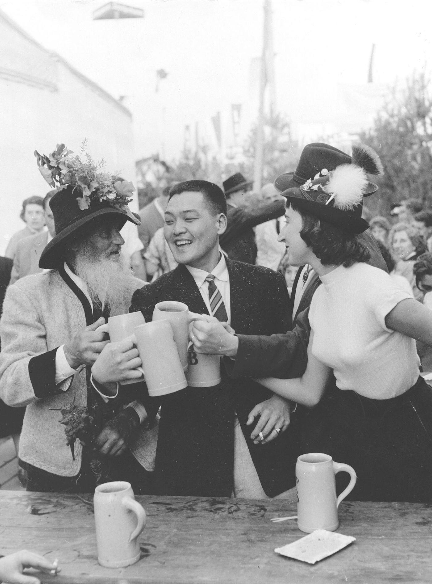 #9 Japanese tourists enjoy Oktoberfest with Bavarians, 1960.