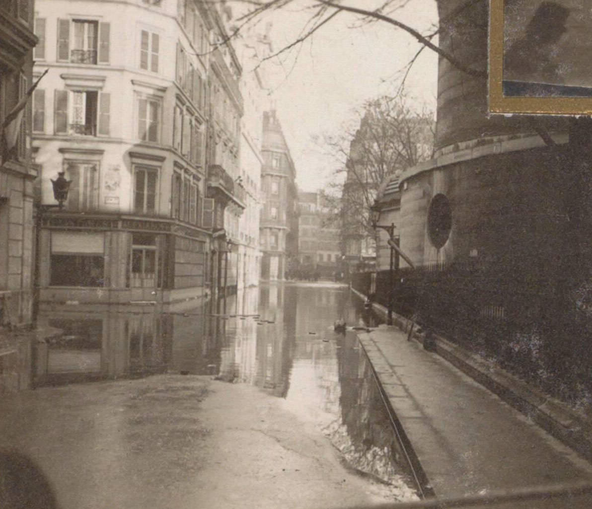 #77 Partially flooded street during Paris flood. Part of photo album flooding Paris and suburbs 1910.