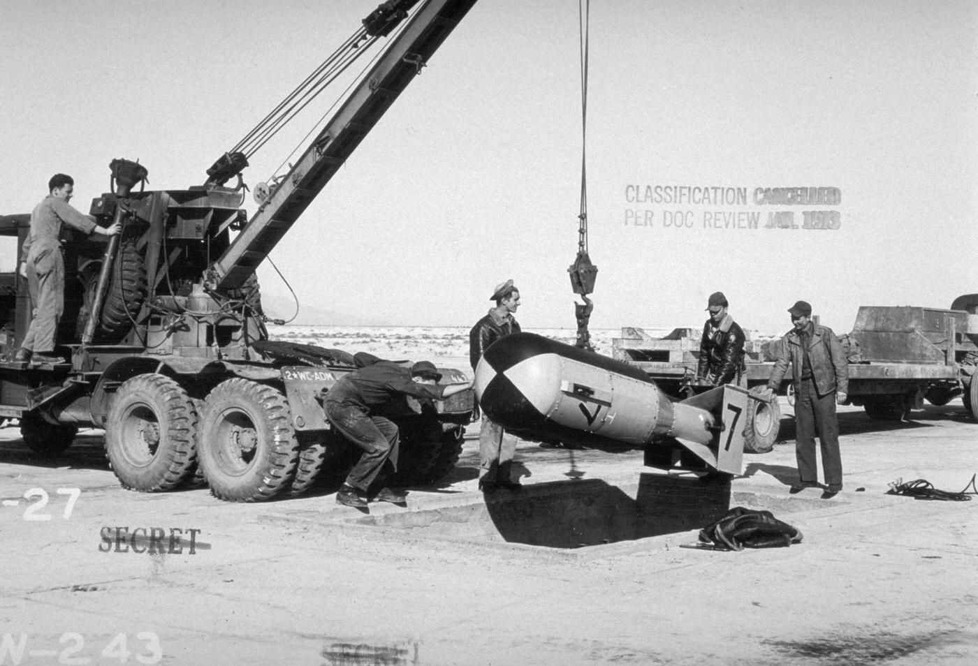 #25 Military Personnel Loading Bomb onto Crane, New Mexico