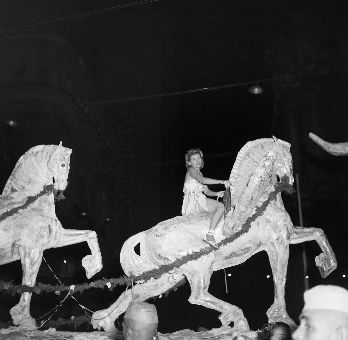 #100 Carnival parade revelers on a float in Rio de Janeiro’s Carnival. 1953