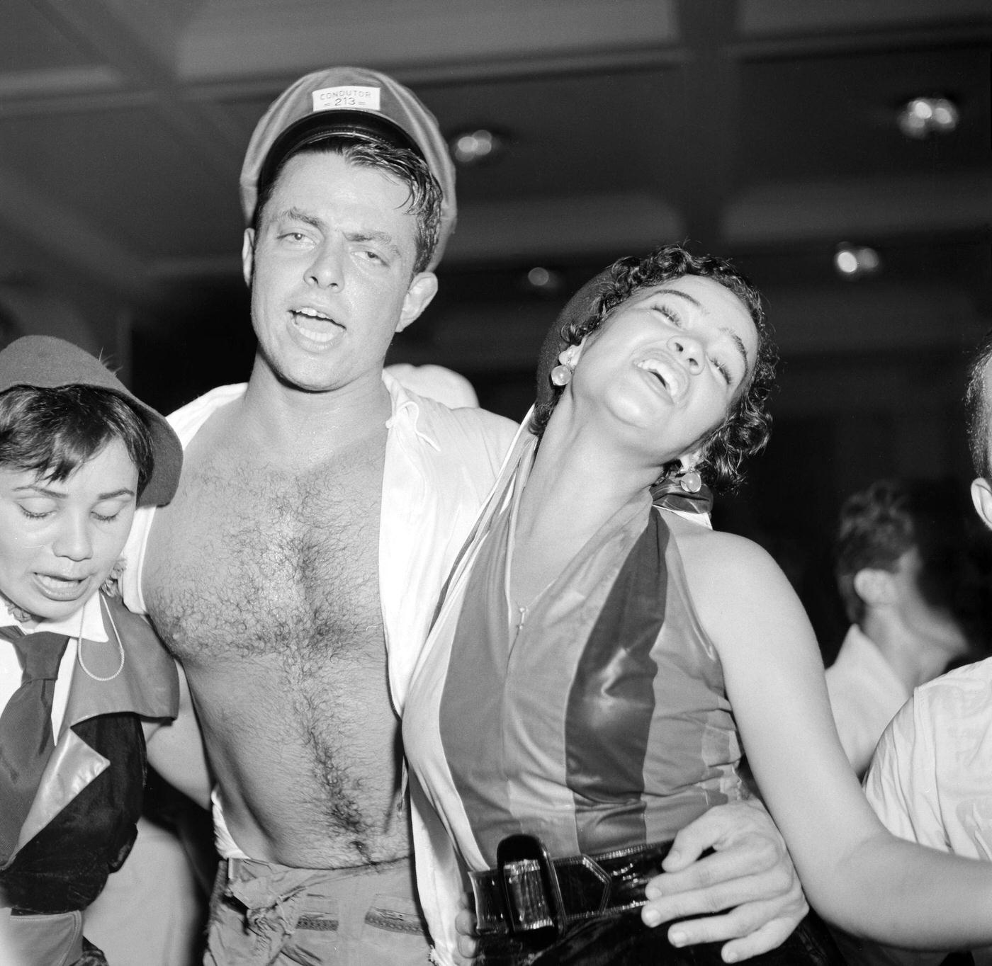 #76 Carnival partygoers celebrate during Rio de Janeiro’s Carnival. 1953