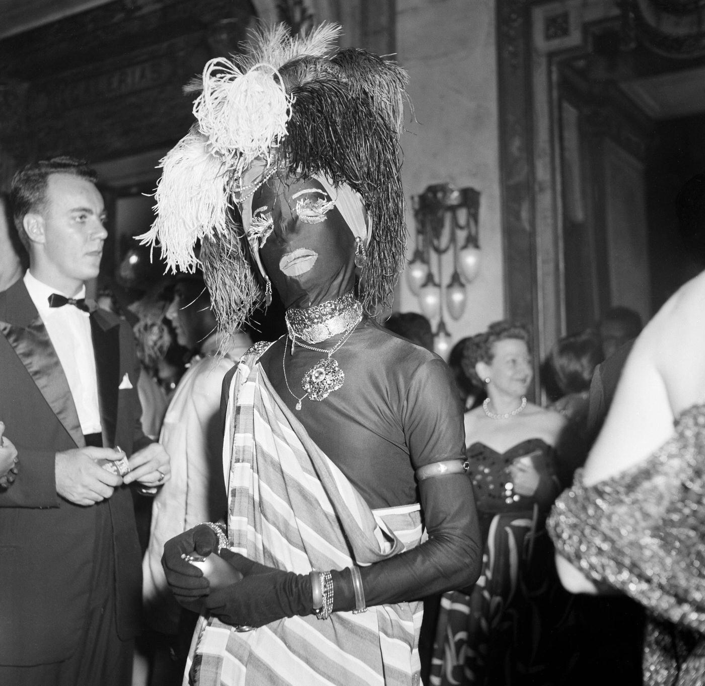 #77 Man in costume enjoys Rio de Janeiro’s Carnival festivities. 1953