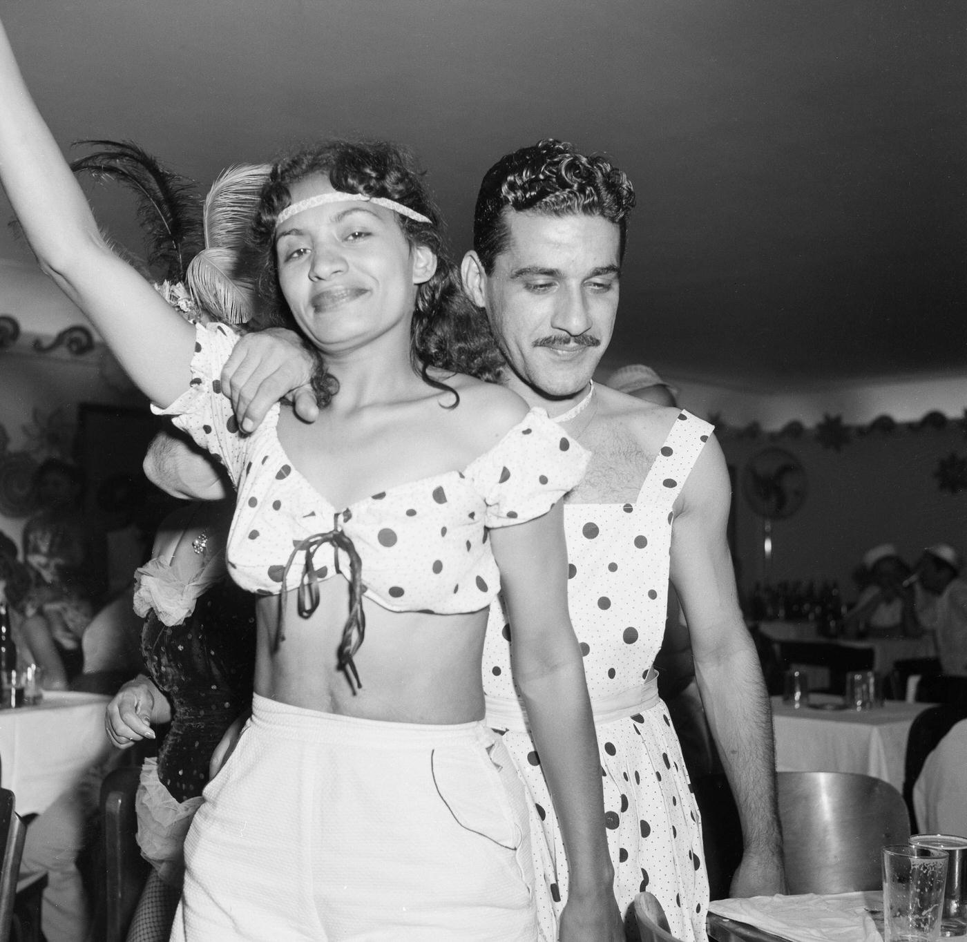 #85 Carnival parade revelers in costumes party in Rio de Janeiro’s Carnival. 1953