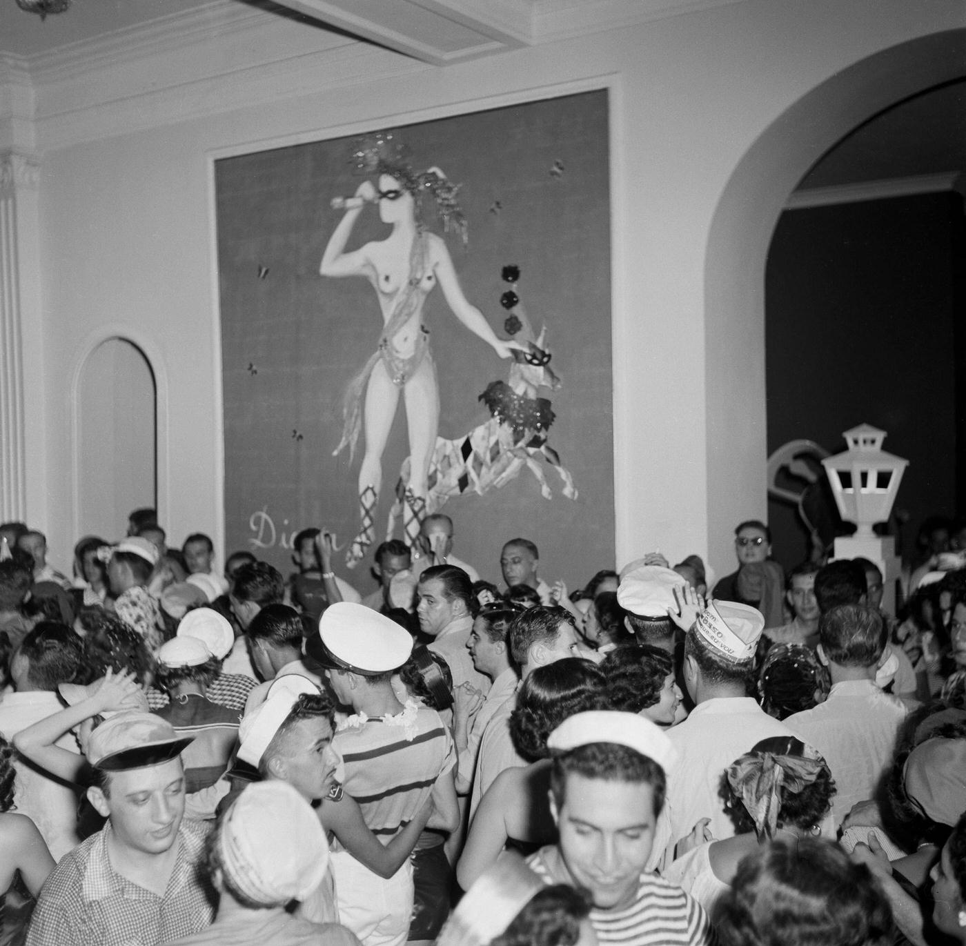 #92 Carnival parade revelers in costumes party in Rio de Janeiro’s Carnival. 1953