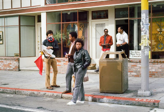 #12 Masked Man Selling Newspapers, 24th Street, 1984