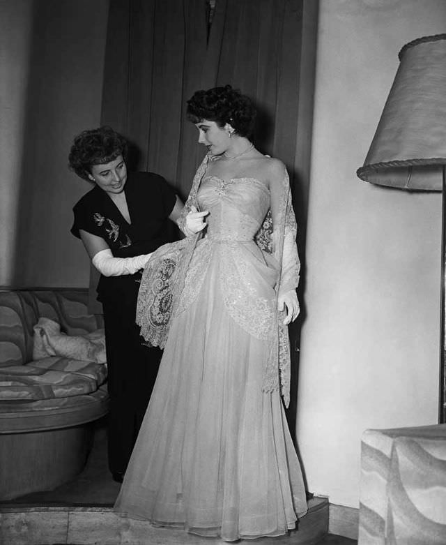 #9 At the Savoy Hotel, Sara Sothern helps her daughter Elizabeth Taylor to dress for the Royal Command Film Performance, London, 29th November 1948. The screening will be at the Empire cinema, Leicester Square
