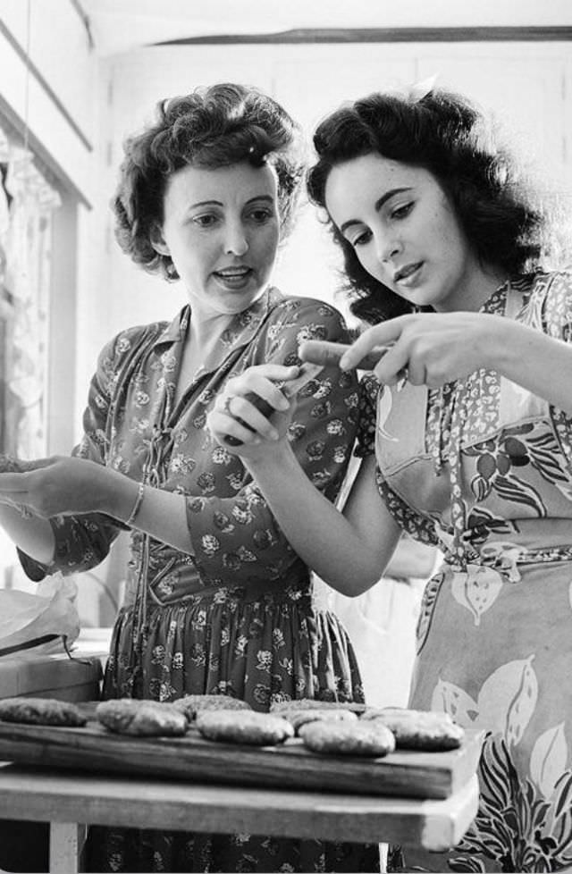 #5 Elizabeth makes hamburgers in the home’s kitchen with her mother, 1947
