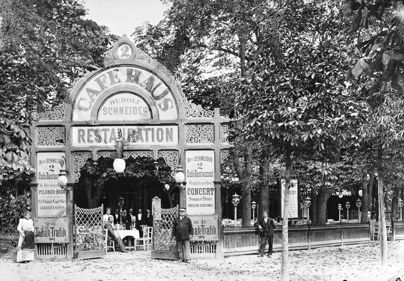 #14 Vienna: Coffee House in Prater. Cafe-Restaurant by Rudolf Schneider. Entrance with the view on chestnut wood Guest garden, Around 1900