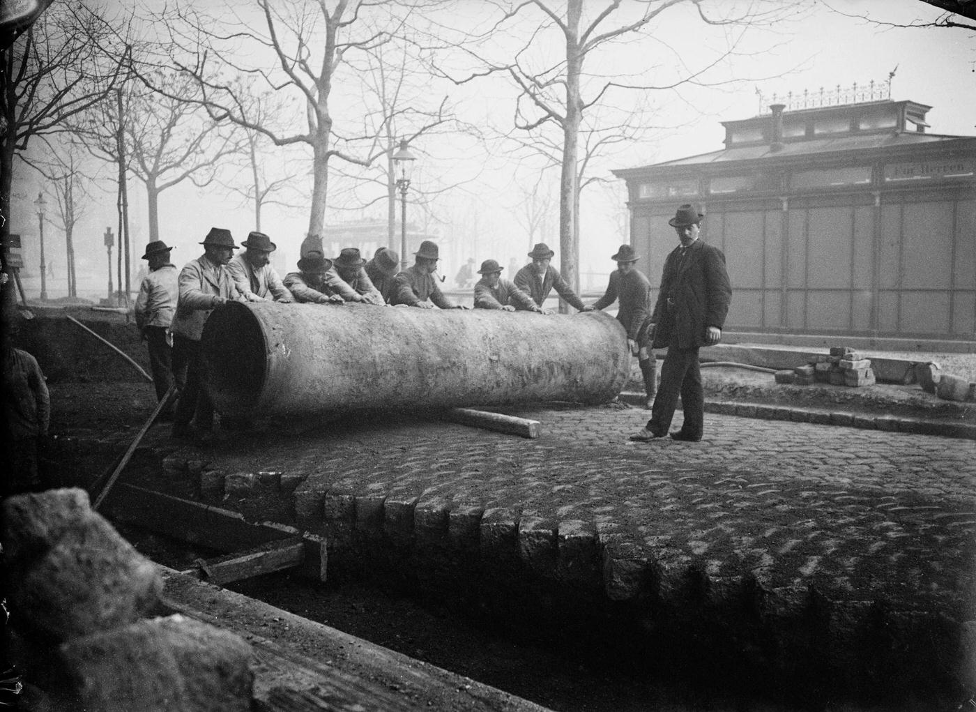 #42 Man piping a sewer pipe, Vienna, 1900s