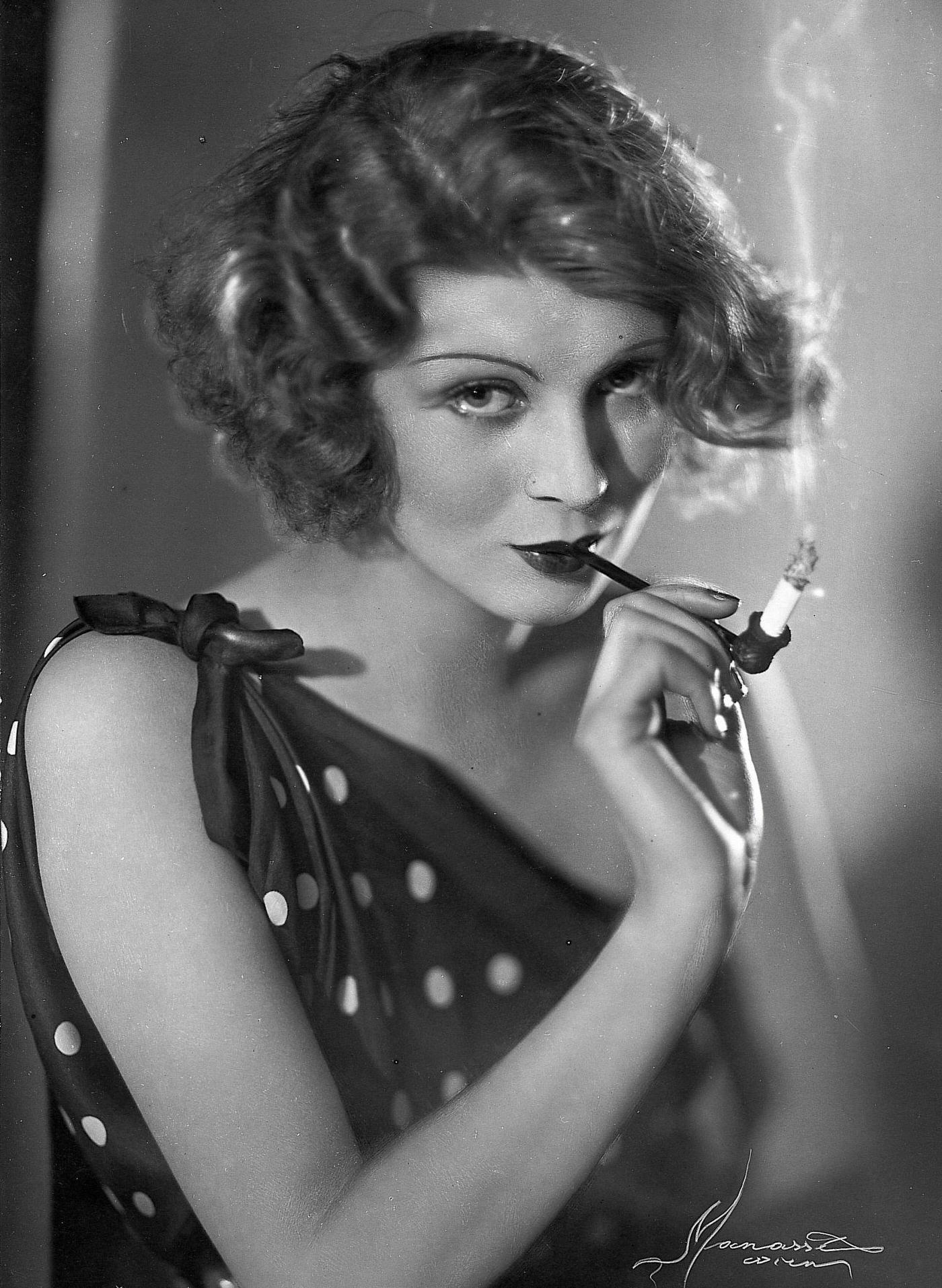 #28 Pipe smoking diva, brunette photomodel, seductive pose, 1930.