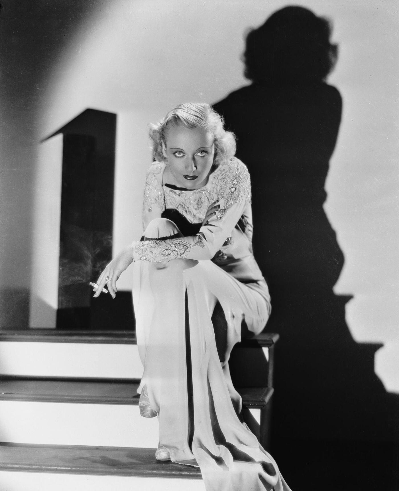 #39 American film actress Carole Lombard casts a dramatic shadow against the wall, 1942.