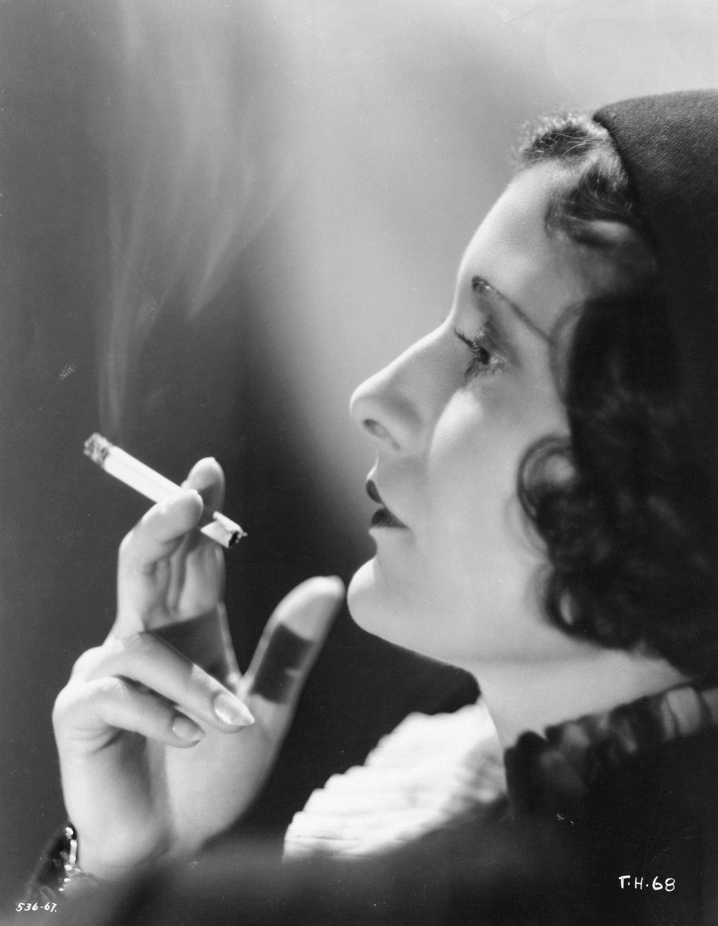 #40 Actress Evelyn Brent playing the lead role of Ruby Smith in the comedic crime film Traveling Husbands, 1931.