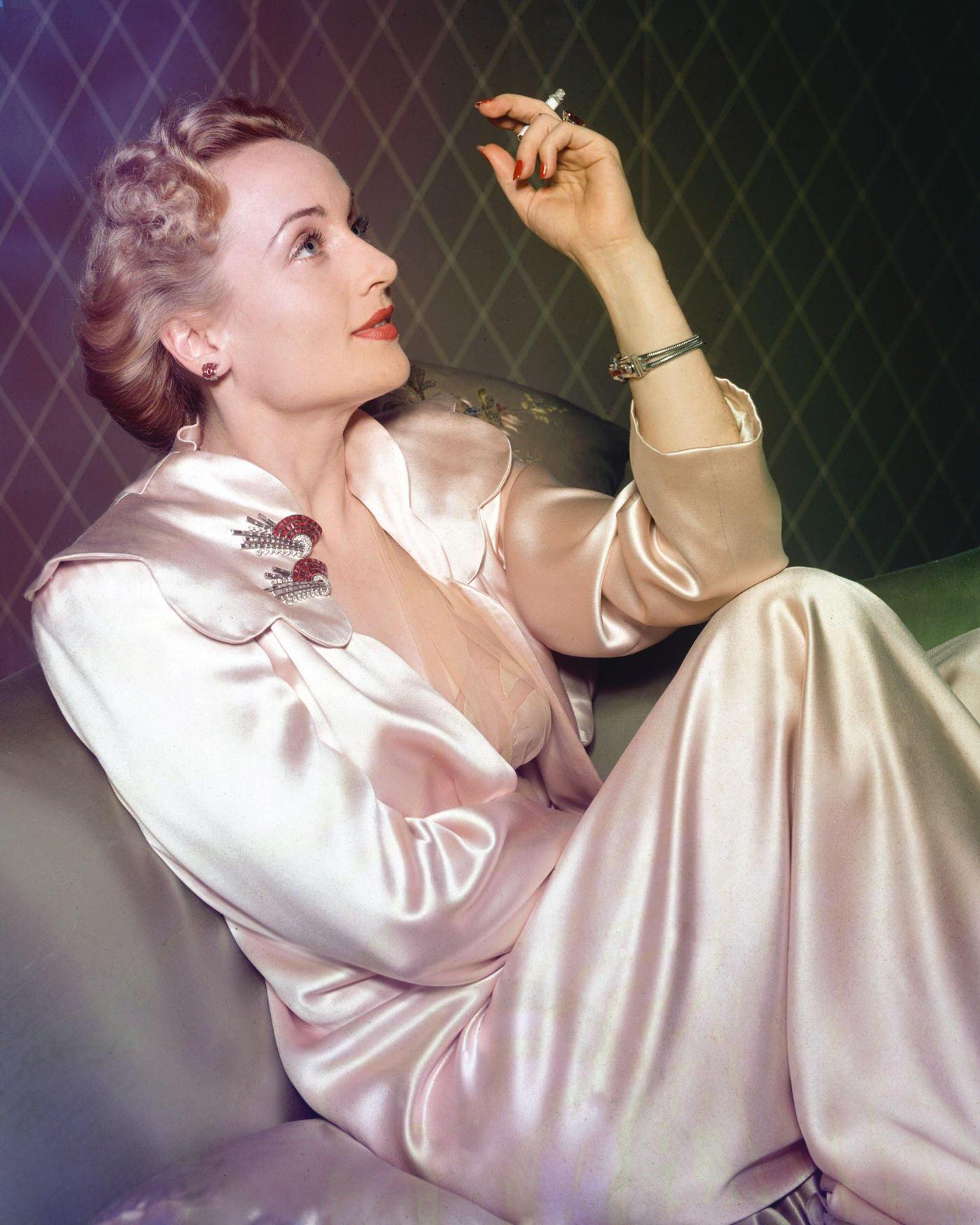 #59 American actress Carole Lombard in a satin dressing gown, 1935