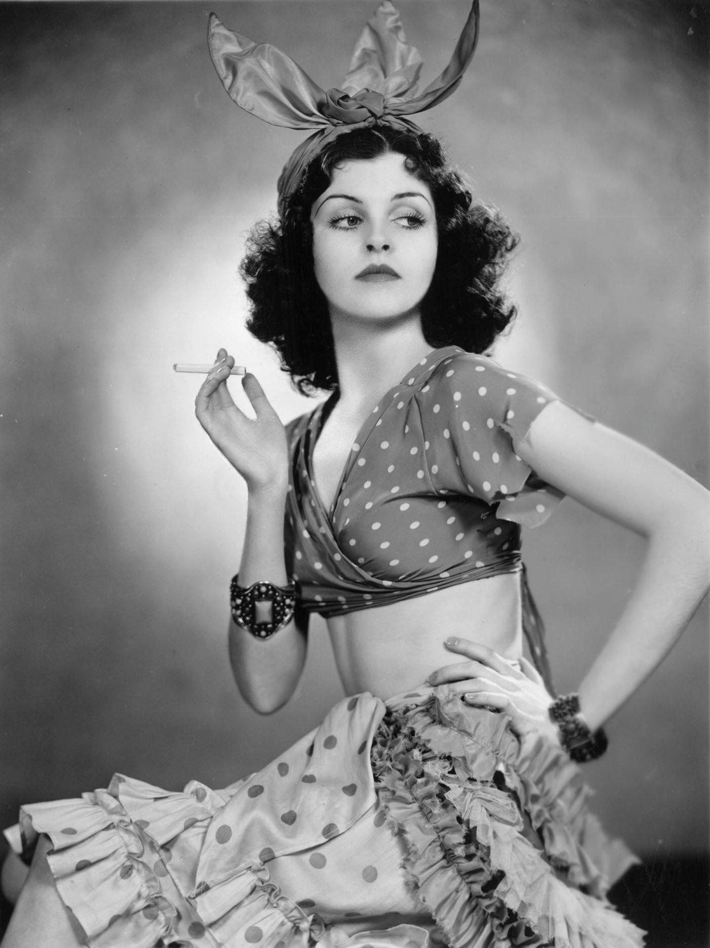 #67 American prima ballerina Eileen O’Connor in costume for ‘Follow The Sun’, 1936