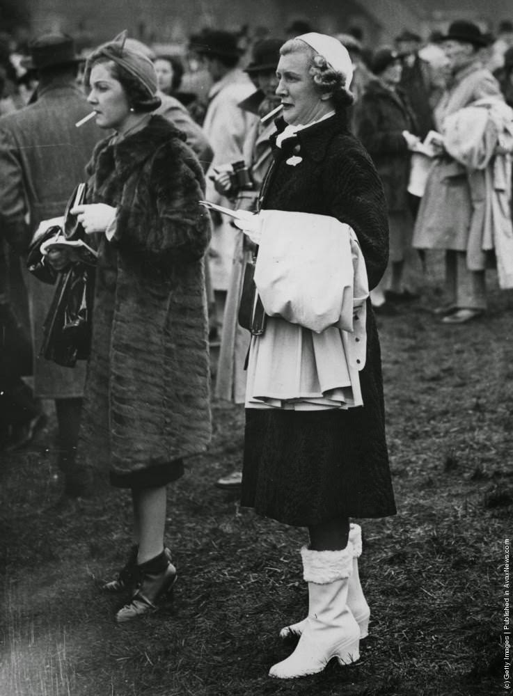 #15 Two racegoers obviously need a cigarette to calm their nerves, 25th March 1938