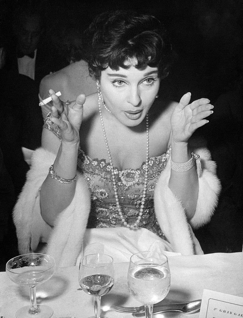 #24 Italian actress Silvana Pampanini smoking a cigarette during the International Film Festival of Punta del Este, 1950s.