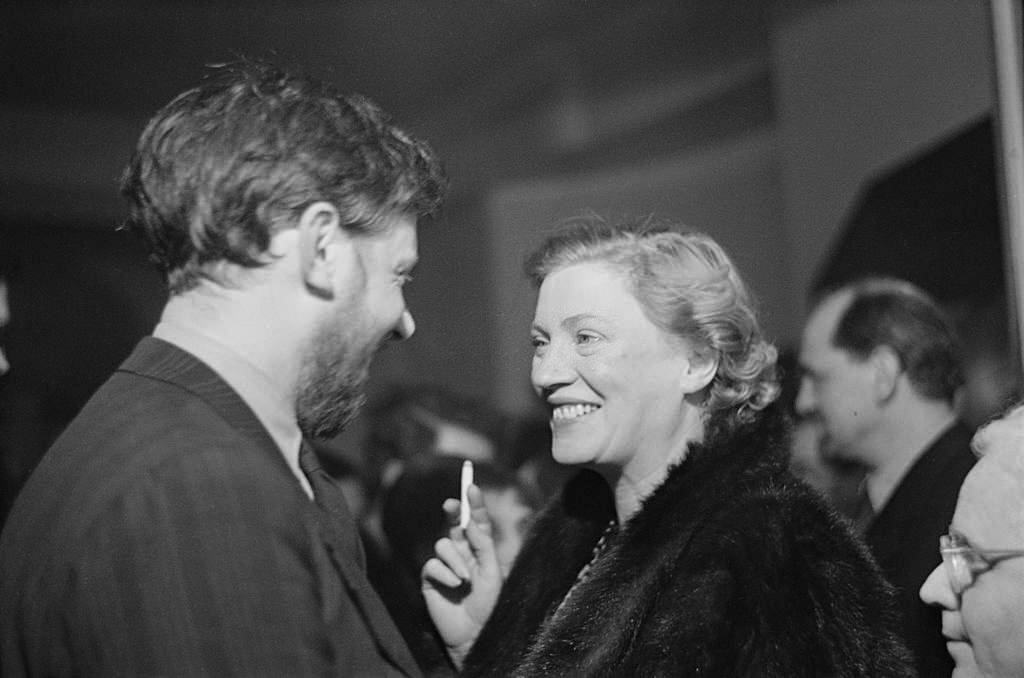 #37 Frederick Laws and American photographer Lee Miller smoking at a one-night performance in London, March 1950.
