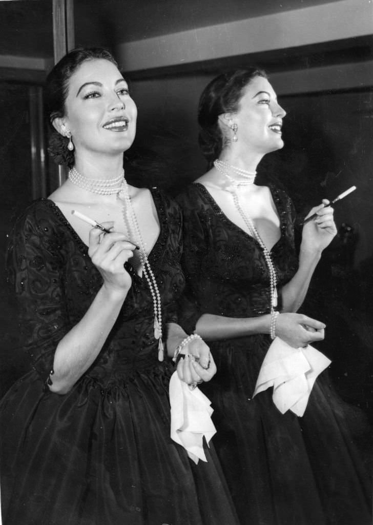 #63 American actress Ava Gardner at a press reception at the Savoy Hotel, London, 1955.
