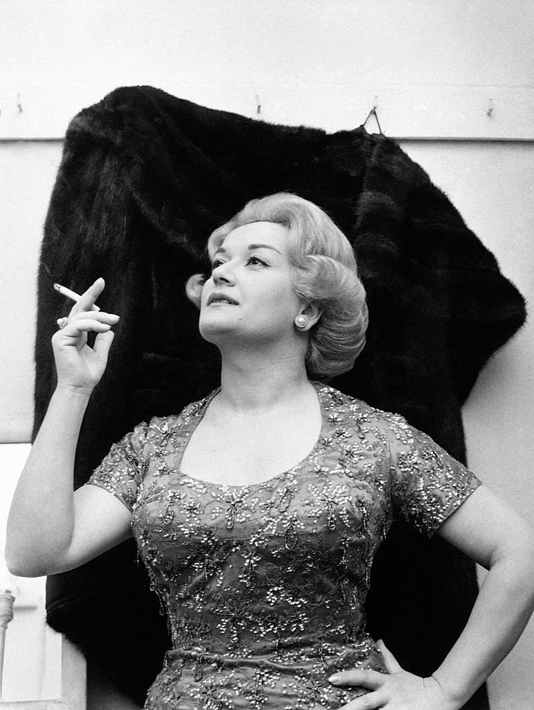 #78 Italian singer Flo Sandon’s posing with a cigarette in April, 1960.