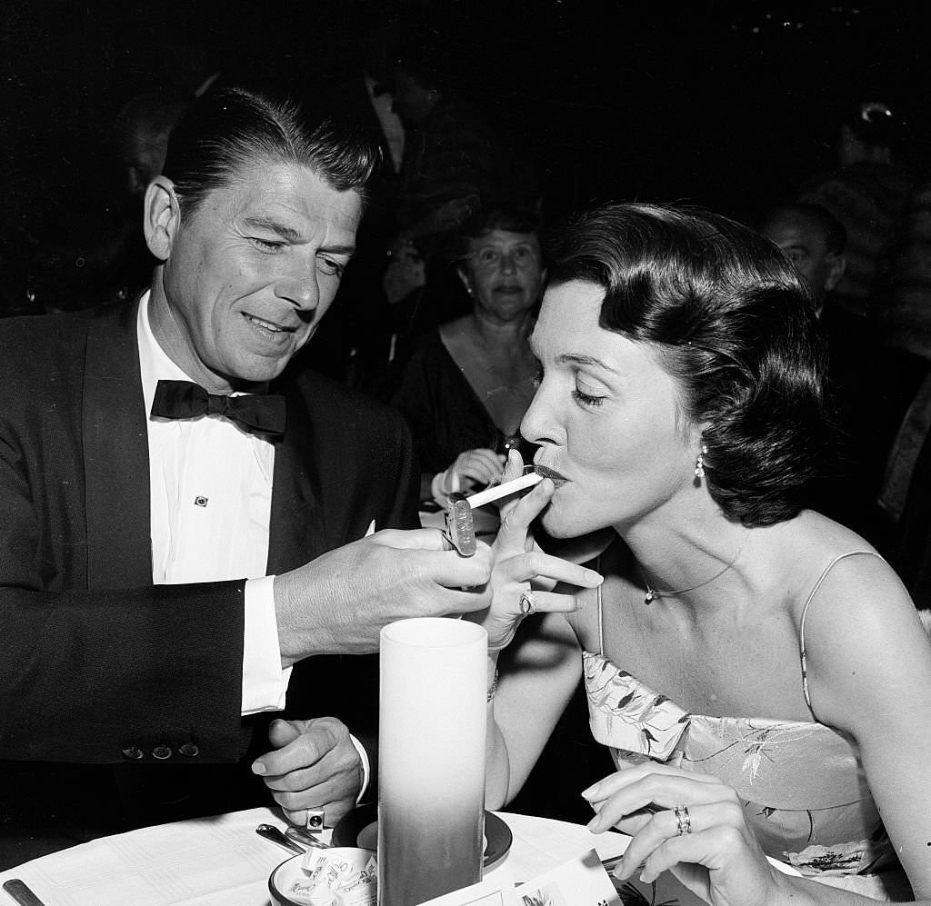 #82 Actor Ronald Reagan and wife Nancy attend the premiere party for “Moby Dick” in Los Angeles, 1956.