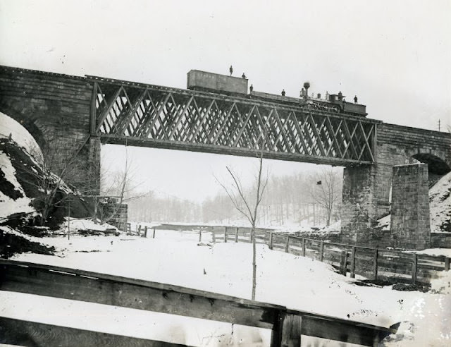 Lake Shore &; Michigan Southern Howe Truss Bridge over the Ashtabula River. Erected after the December 1876 bridge collapse. Ashtabula, Youngstown &; Pittsburgh Railroad boxcar on bridge