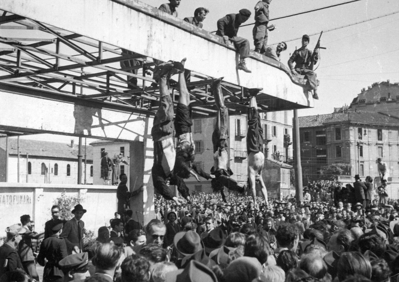 #14 Mussolini and Clara Petacci’s Bodies Hanged After Failed Escape, 1945