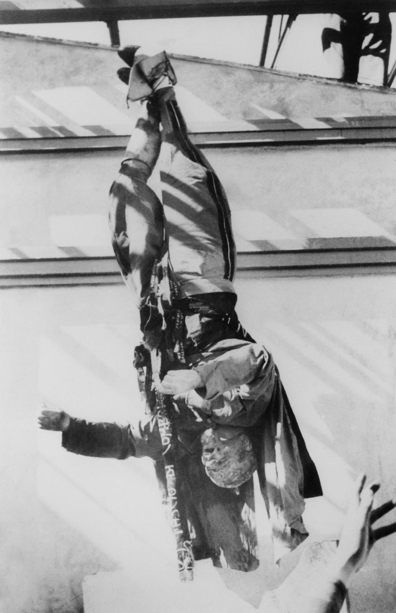 #4 Mussolini’s Corpse Displayed at Piazzale Loretto After Execution in Milan, 1945
