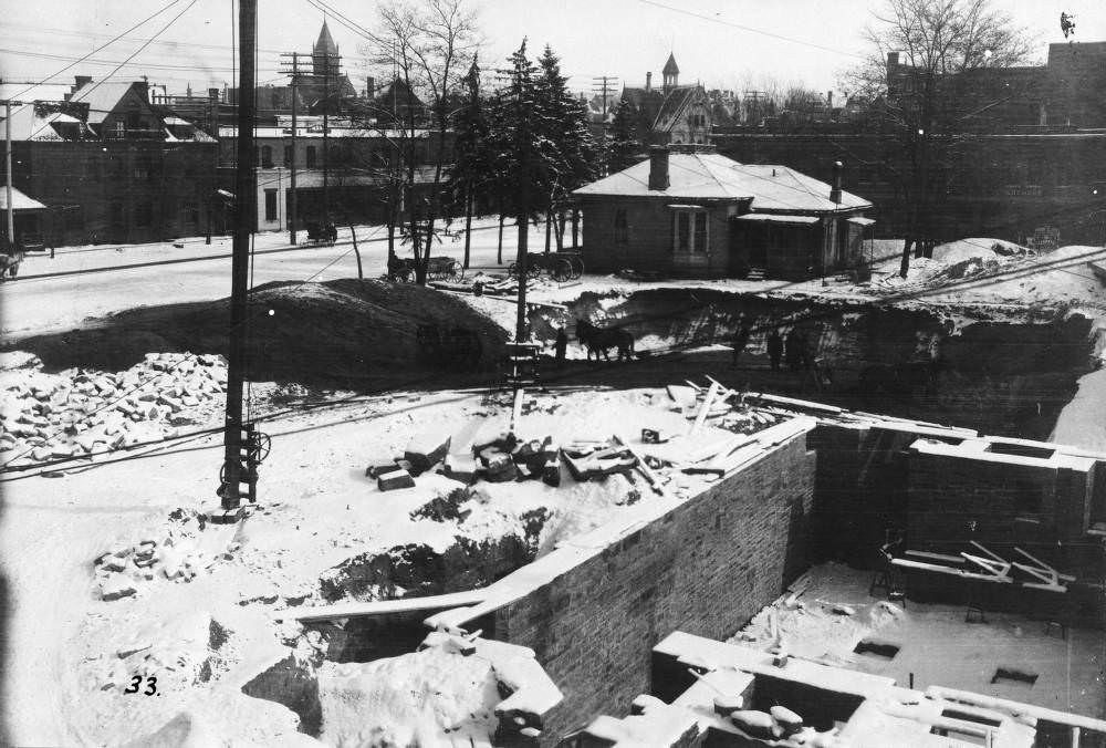 #98 Construction of Denver Public Library halted by snow, Civic Center and Engine House Number One in background, 1900s