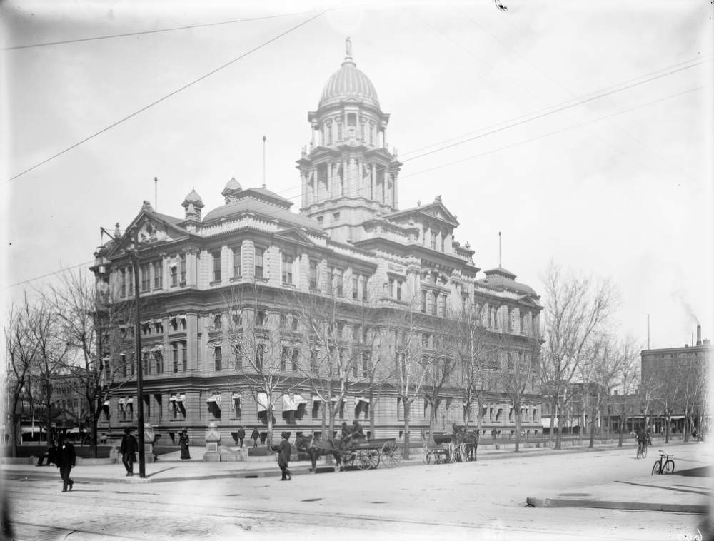 #28 Pedestrians and buggies near the Denver County Courthouse, formerly known as Arapahoe County Courthouse, 1900s