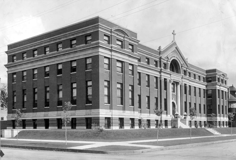 #146 Saint Mary’s Academy, Capitol Hill, Denver featuring stone trim and a cross, 1900s