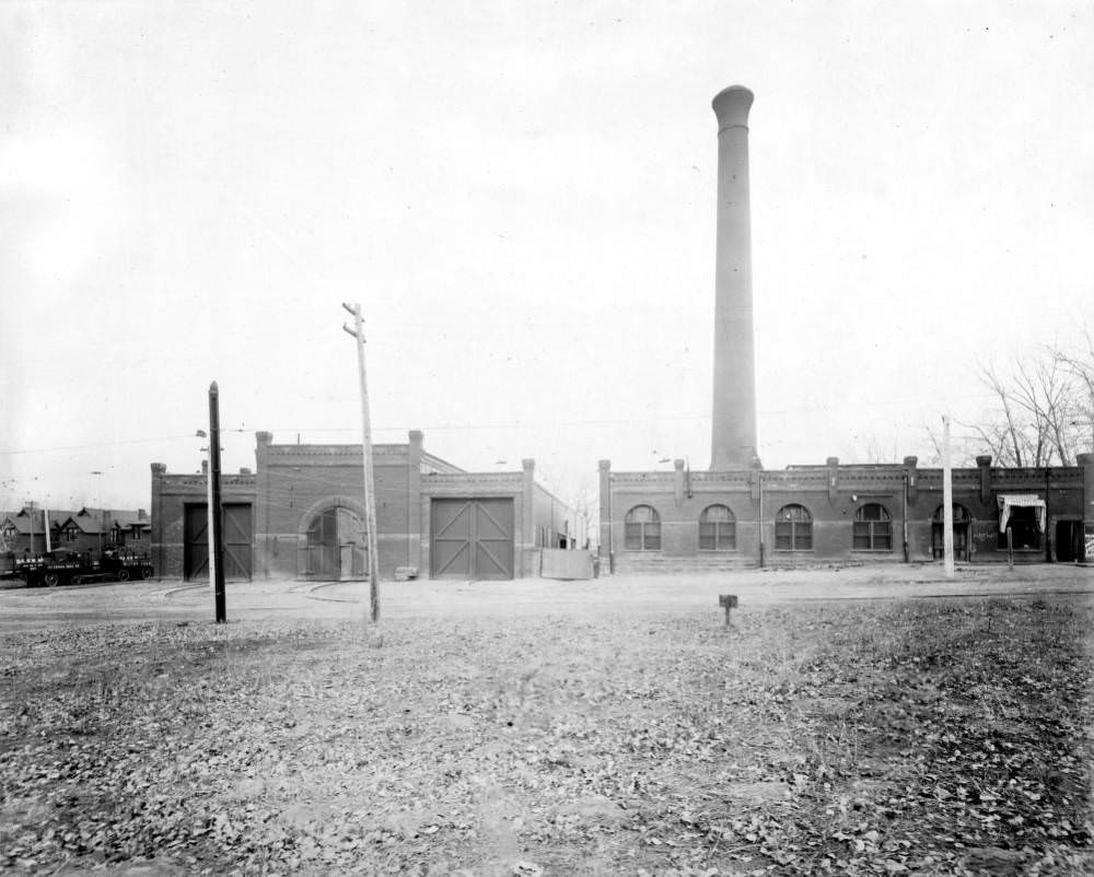 #148 DTC garage on 38th Avenue with Leyden Coal Co. and Wilcox Drug store, 1905.