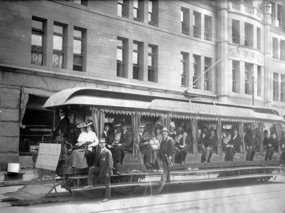 #6 Denver Tramway trolley No. 112 in front of Brown Palace Hotel with various signs, 1905.