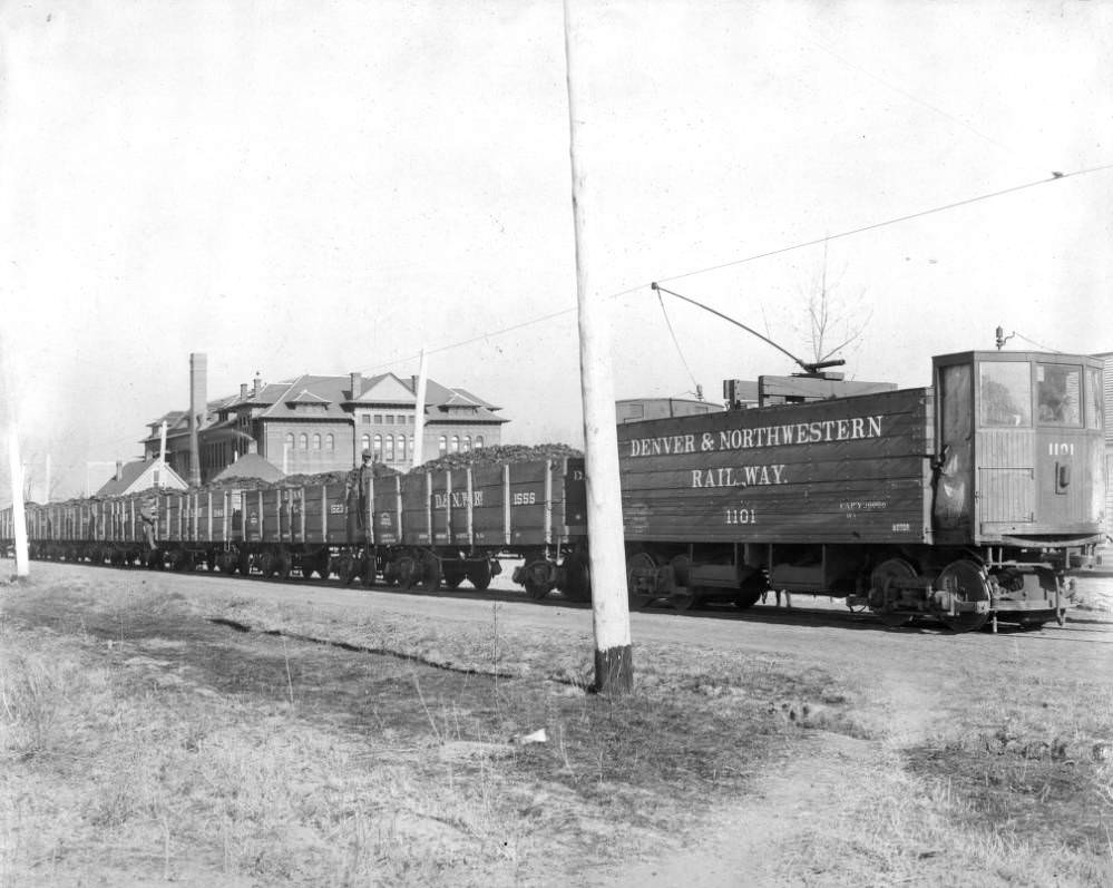 #37 Leyden Mine coal trains with Denver & Northwestern Railway cars, featuring Alcott Public School, 1905.