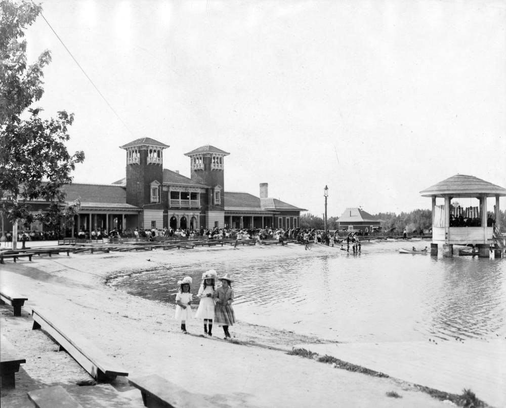 #62 Girls by City Park Lake, people at pavilion benches, and a band performing, 1905.