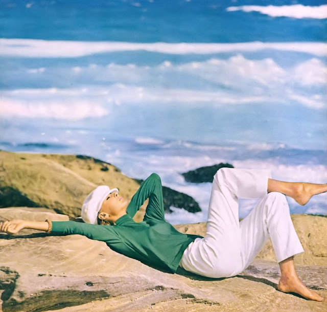 #13 Camilla Sparv in a silk jersey top and white pants in Australia, May 1964