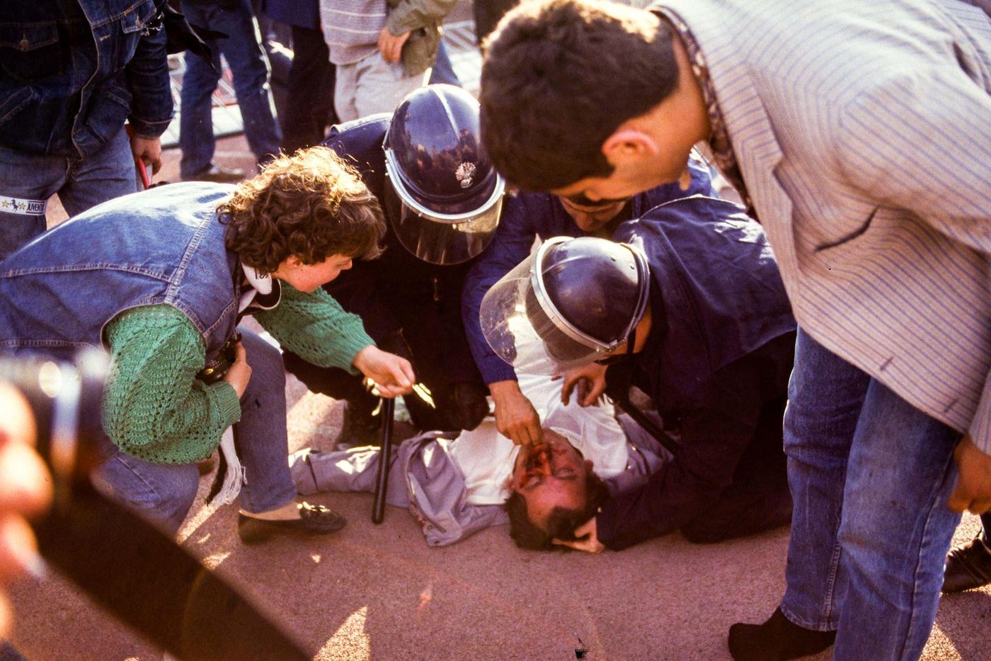 #18 Supporter receives first aid by security police at Heysel Stadium, European Cup Final, 1985.