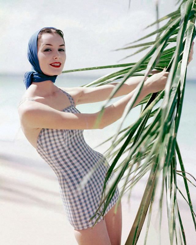 #23 Lucinda Hollingsworth in a lastex swimsuit by Catalina, complemented by a scarf by Echo, 1956.