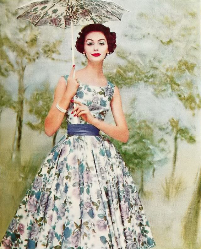 #25 Lucinda Hollingsworth in a warp print dress with a simple bodice and circular skirt, 1957.