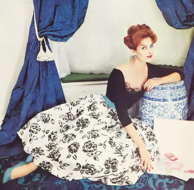 #29 Anne St. Marie in a black jersey blouse and printed rose silk shantung skirt, 1958.